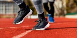 Bidding for Renovation of the Kim Collins Stadium Now Open, Closes July 29 Close up of runner feet running on track.